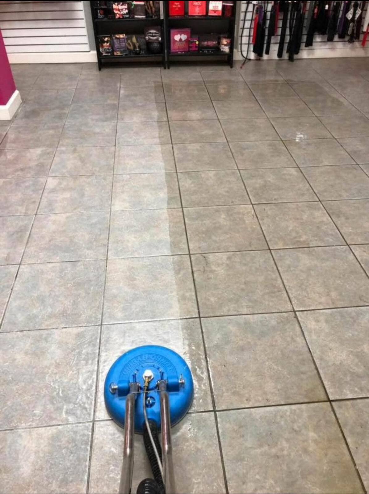 Tile and grout cleaning in progress in a retail store